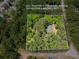 Aerial view of wooded 3.0 acre lot with home site and rough property lines at 5216 Wheeler Dr, Loganville, GA 30052