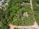 Aerial view of a heavily wooded 3.0 acre lot with rough property lines at 5216 Wheeler Dr, Loganville, GA 30052
