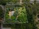 Aerial view of a heavily wooded 3.0 acre lot with rough property lines at 5216 Wheeler Dr, Loganville, GA 30052
