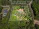 Aerial view of a wooded 3.0 acre lot with home site, and rough property lines at 5216 Wheeler Dr, Loganville, GA 30052