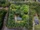 Aerial view of wooded 3.0 acre lot with home site and rough property lines at 5216 Wheeler Dr, Loganville, GA 30052