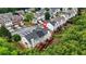 An elevated shot of a townhome community shows private rear decks with wooded surroundings and convenient access to parking at 5989 Turfway Park Ct, Sugar Hill, GA 30518