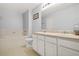 Bright bathroom with soaking tub, double sink vanity, and white cabinetry at 5989 Turfway Park Ct, Sugar Hill, GA 30518