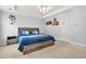 Comfortable bedroom with a ceiling fan, bed, and decor at 5989 Turfway Park Ct, Sugar Hill, GA 30518