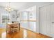 Dining area featuring a chandelier, and view of the open hallway and stairway at 5989 Turfway Park Ct, Sugar Hill, GA 30518