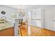 Kitchen and dining area with granite countertops and view of an upstairs hallway at 5989 Turfway Park Ct, Sugar Hill, GA 30518