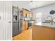 Charming kitchen with stainless steel appliances, wood cabinets, and granite countertops at 5989 Turfway Park Ct, Sugar Hill, GA 30518