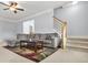 Open concept living room with carpet, staircase, lots of light and plush furniture at 5989 Turfway Park Ct, Sugar Hill, GA 30518