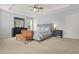 Tranquil main bedroom with neutral colors, tray ceiling and large windows at 5989 Turfway Park Ct, Sugar Hill, GA 30518