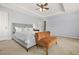 Tranquil main bedroom with neutral colors, tray ceiling and large windows at 5989 Turfway Park Ct, Sugar Hill, GA 30518