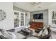 Covered porch with a ceiling fan, wicker furniture and a tv at 735 Longwood Nw Dr, Atlanta, GA 30305