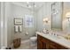Elegant powder room featuring patterned wallpaper, a dark wood vanity, and a stylish mirror at 735 Longwood Nw Dr, Atlanta, GA 30305