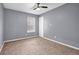 This bedroom features plush carpet and natural light at 2505 Tiffany Se Ct, Conyers, GA 30013