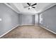 Bedroom featuring neutral carpet, two windows, and neutral walls at 2505 Tiffany Se Ct, Conyers, GA 30013