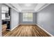 Dining room with hardwood floors, a tray ceiling, and neutral gray walls at 2505 Tiffany Se Ct, Conyers, GA 30013