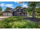 Charming two-story home featuring a well-manicured front yard and a cozy front porch at 2505 Tiffany Se Ct, Conyers, GA 30013