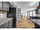 Modern kitchen showcasing stainless steel appliances, dark cabinetry, and granite countertops at 2505 Tiffany Se Ct, Conyers, GA 30013