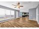 An open-concept living room features a ceiling fan and flows into the kitchen at 2505 Tiffany Se Ct, Conyers, GA 30013