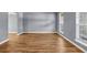 Living room featuring neutral gray walls and gleaming hardwood floors at 2505 Tiffany Se Ct, Conyers, GA 30013