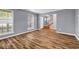 Spacious living room with hardwood floors, natural light and neutral paint at 2505 Tiffany Se Ct, Conyers, GA 30013