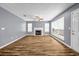 Spacious living room featuring a fireplace and natural light from large windows at 2505 Tiffany Se Ct, Conyers, GA 30013