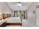 Spacious bedroom with vaulted ceilings, a ceiling fan, and natural light at 3925 Tugaloo River Dr, Duluth, GA 30097