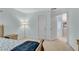 Bedroom featuring a bed, and a doorway to another room at 3925 Tugaloo River Dr, Duluth, GA 30097