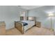 Bedroom featuring a bed with a full bedroom set at 3925 Tugaloo River Dr, Duluth, GA 30097