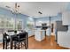 Open concept kitchen with stainless steel appliances, island, and easy access to dining at 3925 Tugaloo River Dr, Duluth, GA 30097