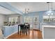 Eat-in kitchen with natural light, an open-concept design, and easy access to the backyard at 3925 Tugaloo River Dr, Duluth, GA 30097