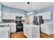Modern kitchen with stainless steel appliances, island and plenty of cabinet space at 3925 Tugaloo River Dr, Duluth, GA 30097