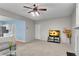 Open living room featuring plush carpeting and a modern entertainment setup at 3925 Tugaloo River Dr, Duluth, GA 30097