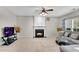 Comfortable living room with a fireplace, plush seating, and natural light at 3925 Tugaloo River Dr, Duluth, GA 30097