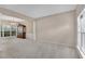 Open concept living room with carpet, abundant natural light, and a decorative chandelier at 3925 Tugaloo River Dr, Duluth, GA 30097