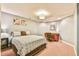 Cozy bedroom with comfortable bed, a desk, and neutral paint colors at 5675 Habersham Vly, Suwanee, GA 30024