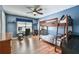 bedroom with a wooden bunk bed, desk and hardwood floors with an airy blue paint at 5675 Habersham Vly, Suwanee, GA 30024