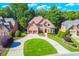 Impressive brick home boasts a manicured lawn, circular driveway and a two-car garage in a lovely neighborhood at 5675 Habersham Vly, Suwanee, GA 30024