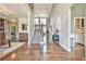 Grand two-story foyer with hardwood floors, elegant staircase, and arched transom, offering a welcoming entrance at 5675 Habersham Vly, Suwanee, GA 30024