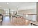 Upstairs game room with a beautiful pool table, hardwood floors and black metal railings at 5675 Habersham Vly, Suwanee, GA 30024