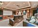 A comfortable home theater features tiered seating, a large screen, and a projector for an immersive viewing experience at 5675 Habersham Vly, Suwanee, GA 30024