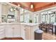 Open kitchen features an island with seating, stainless steel appliances, and adjacent dining area, ideal for entertaining at 5675 Habersham Vly, Suwanee, GA 30024