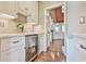 Bright butler's pantry features custom cabinets, beverage fridge and marble countertops; ideal for entertaining at 5675 Habersham Vly, Suwanee, GA 30024