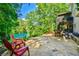 Large outdoor stone patio perfect for entertaining with lake views and relaxing seating at 5675 Habersham Vly, Suwanee, GA 30024