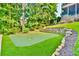Backyard putting green with well-maintained turf and professional-grade design at 5675 Habersham Vly, Suwanee, GA 30024