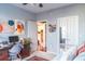 Bedroom featuring a desk, artwork, and open doorway to the kitchen at 10 Perimeter Summit Ne Blvd # 4315, Brookhaven, GA 30319