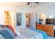 Bedroom featuring a dresser, doorway to the bathroom, and stylish decor at 10 Perimeter Summit Ne Blvd # 4315, Brookhaven, GA 30319
