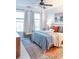 Bright bedroom with plush bedding, decorative pillows, ceiling fan, and large windows at 10 Perimeter Summit Ne Blvd # 4315, Brookhaven, GA 30319