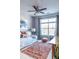 Bedroom with a daybed, large window, decor, and ceiling fan at 10 Perimeter Summit Ne Blvd # 4315, Brookhaven, GA 30319