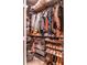Walk-in closet showing shelving and an abundance of folded and hanging clothing at 10 Perimeter Summit Ne Blvd # 4315, Brookhaven, GA 30319