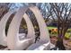 Modern community benches in a park-like setting with landscaping, seating, and walking paths, and the community lawn area in the background at 10 Perimeter Summit Ne Blvd # 4315, Brookhaven, GA 30319